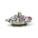 A Meissen porcelain twin candle table centre, 19th Century, designed with twelve outstretched leaves