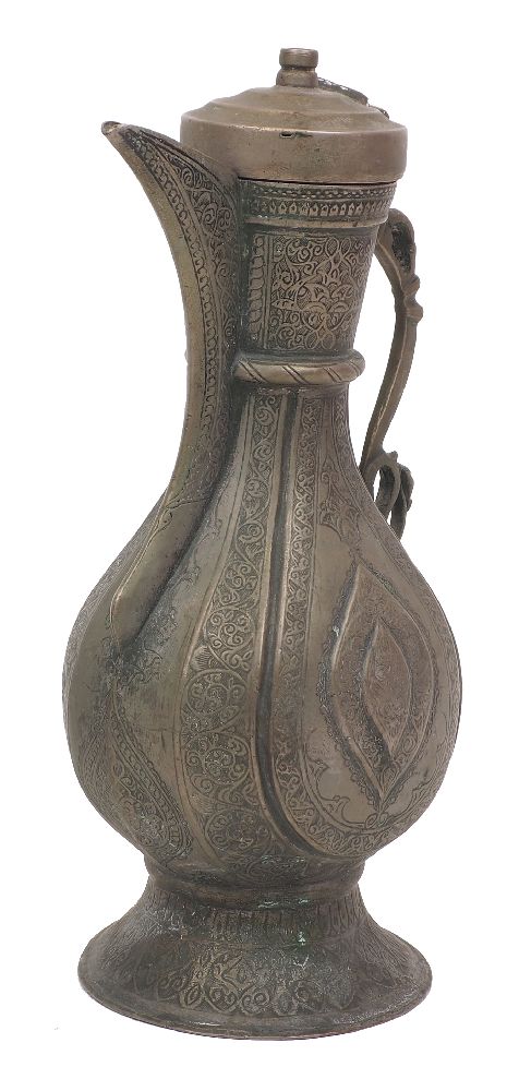 An engraved tinned copper ewer, Bukhara, Central Asia, 19th century, engraved with flowers, tendrils