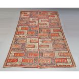 A Caucasian Soumak woollen carpet, made in two sections, the 'S' design panels, incorporating