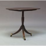 An early 19th Century mahogany occasional tea table, circa 1820, the oblong rounded tilt-top