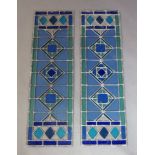 A pair of modern narrow stained glass panels, designed in green and blue glass with diamond motif to
