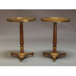 A pair of early 19th Century burr walnut pedestal occasional tables, in the French taste, with a