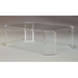 A contemporary Lucite and glass topped coffee table, of oblong octagonal form, raised on rectangular