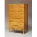 A Swedish walnut chest in style of Axel Larsson, c.1940, with seven drawers, each with copper and