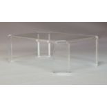 A contemporary Lucite and glass topped coffee table, of oblong octagonal form, raised on rectangular