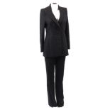 Catherine Walker, a charcoal grey wool two piece trouser suit, together with a a blue sleeveless