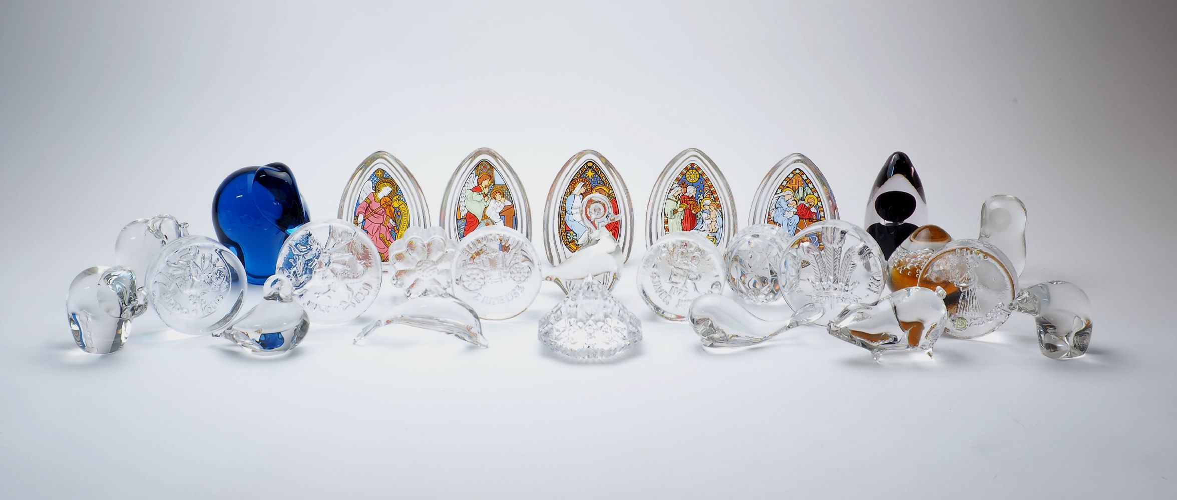 A collection of twenty six glass paperweights, various makers, comprising: Dartington: commemorative