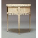 A contemporary limed oak demi-lune tambour fronted side cabinet, the top with a fretwork gallery
