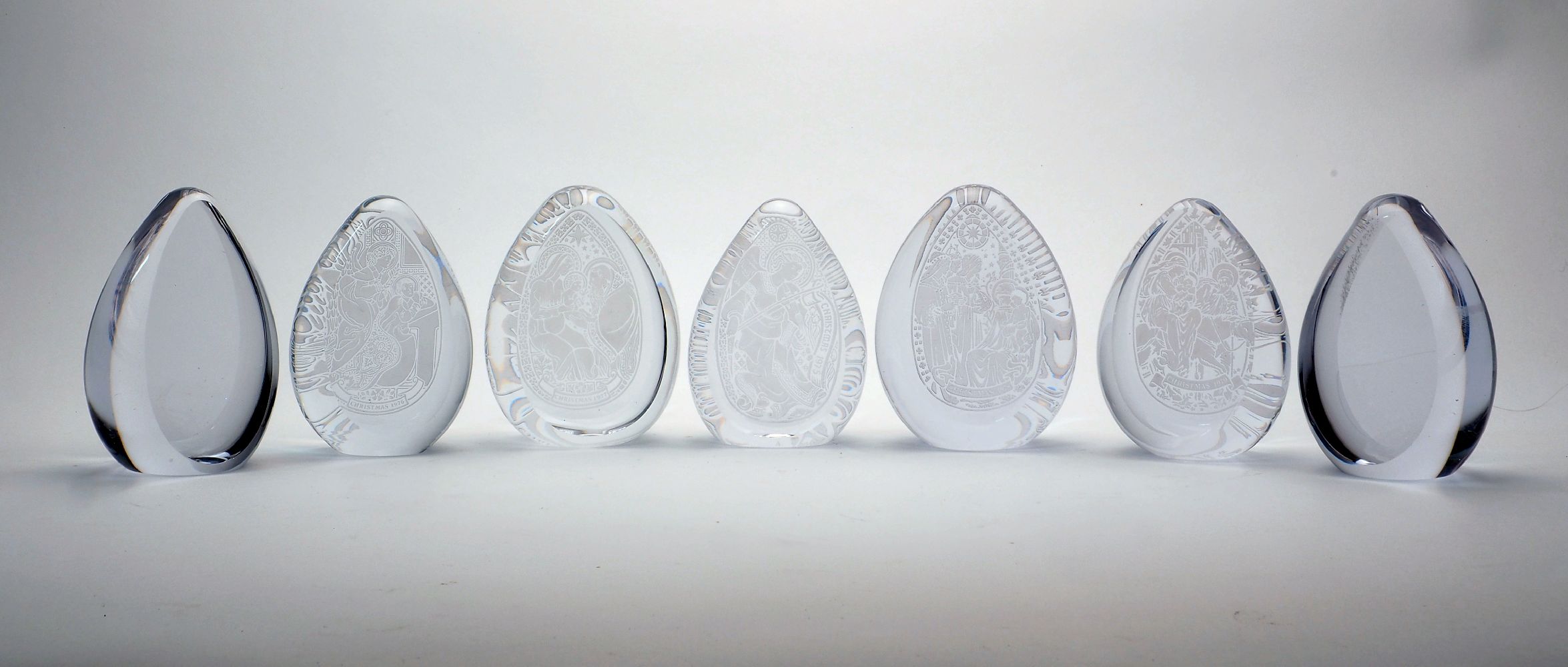 A collection of Wedgwood and other unmarked English clear glass paperweights, 20th Century, to