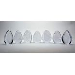 A collection of Wedgwood and other unmarked English clear glass paperweights, 20th Century, to
