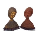 Two female pottery busts, 20th century, of the same model, terracotta, adorned with necklace and