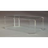 A contemporary Lucite and glass topped coffee table, of oblong octagonal form, raised on rectangular