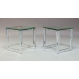 A pair of contemporary square shaped chrome and glass topped side tables, 50cm high, 45cm wide (2)