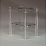 A contemporary Lucite and glass inset two-tier side table, rectangular in form, raised on stile