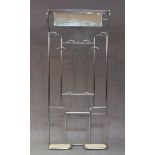 A Bauhaus style tubular chromed hall stand, c.1950, the top with hat rack above adjustable mirror