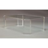 A contemporary Lucite and glass topped coffee table, of oblong octagonal form, raised on rectangular