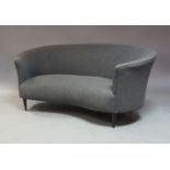 A Mid Century style curved two seater sofa, of recent manufacture, with grey upholstery on