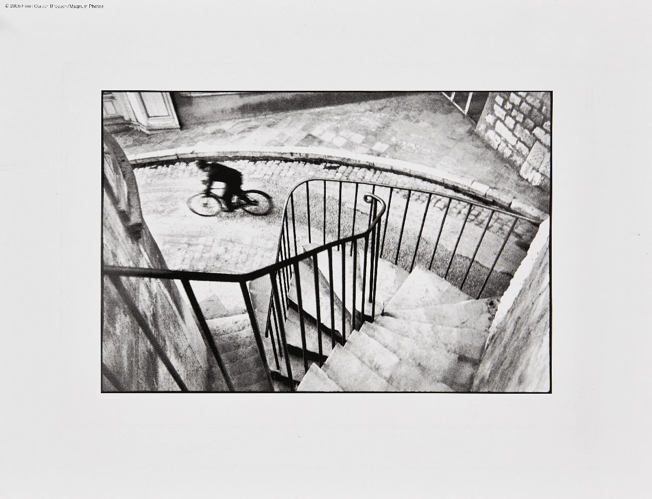 Henri Cartier-Bresson, French 1908-2004- Man Cycling down street, Hyeres, France, 2006; digital