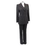 Catherine Walker, a couture grey wool trouser suit, with long pinstripe jacket and plain trousers,