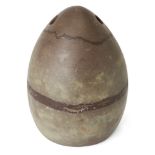 A Bactrian-style stone weight, perforated for suspension at the top, ovoid in form, 25cm. high