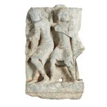 A Gandhara grey schist carved relief of two figures fleeing, 3rd-4th century, deeply carved, one