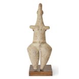 An Amlash-style steatopygous figure, Iran, standing naked with bulbous legs and buttocks, with