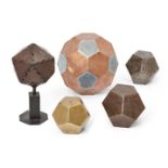 A group of six faceted polyhedrons in various metals, one of rock crystal, largest 22cm. high (6)