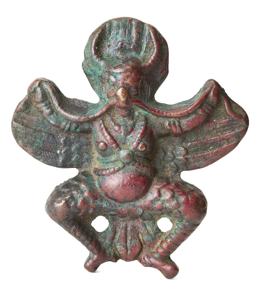 A bronze plaque of Garuda, Tibet or Nepal, 17th century or earlier, the horned deity depicted with