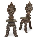 A pair of Syrian bone inlaid hall chairs, 19th century, with scalloped backs and geometric inlay