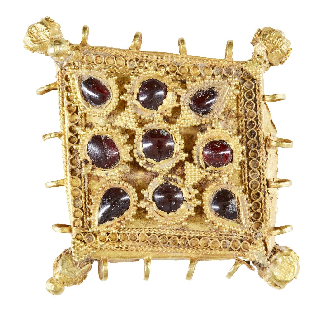 A garnet-set gold pendant element, Iran, 12th century, of diamond shape and box construction, the