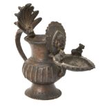 A bronze offering vessel with figure of Ganesha, Nepal, 17th-18th century, on a played foot, the