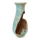 A fragmentary Egyptian blue glazed composition vessel with broad neck expanding to an everted rim,