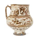 A Kashan lustre pottery jug, Central Iran, late 12-early 13th century, on short flaring foot, with