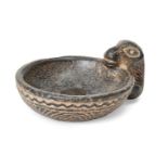 A black schist Bactrian-style drinking cup with feline handle, 7.2cm. Provenance: Private Collection