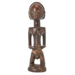 A Tabwa female ancestor figure, Eastern Congo, early 20th century,the heart-shaped face with