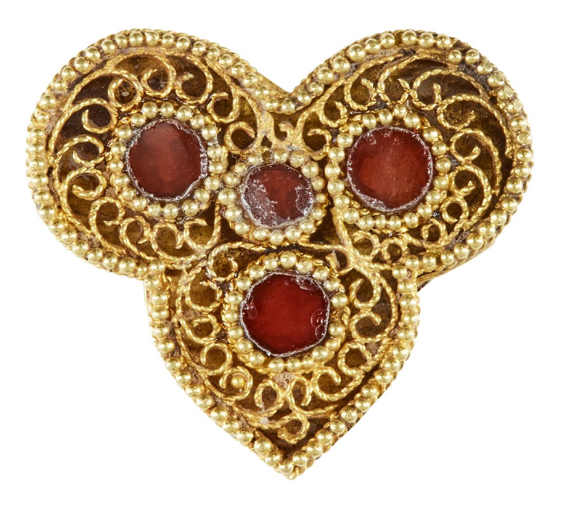 A red glass-set gold element, Iran, 12th-13th century, of trefoil form, the openwork gold filigree