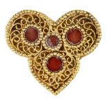 A red glass-set gold element, Iran, 12th-13th century, of trefoil form, the openwork gold filigree