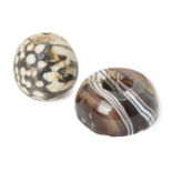 A large mosaic bead and a large banded agate bead, the first egg-shaped with white inclusions and