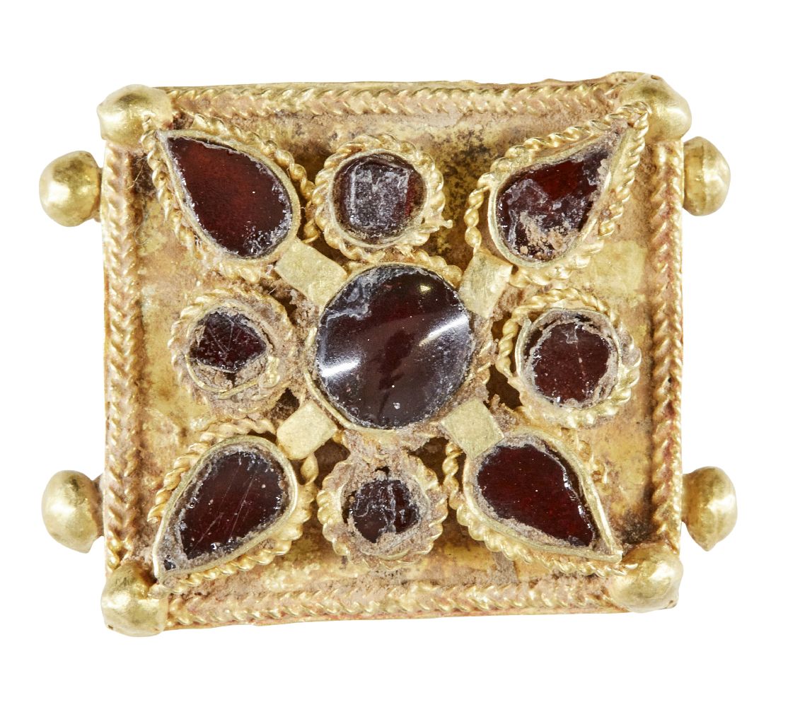 A garnet set gold element, Iran, 12th-13th century, of square form, the central stone with a