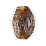 A Western Asiatic banded agate bead, circa 2nd millenium B.C., of elliptical form, carved to one