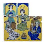 A Qajar cuerda seca tile panel, Iran, 19th century, in the Safavid style, depicting a ruler feasting