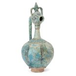 A large Kashan ewer, Central Iran, 12th century, on a short foot, the globular body leading to a
