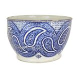 A large Qajar blue and white pottery bowl, Iran, late 19th/early 20th century, of deep rounded form,