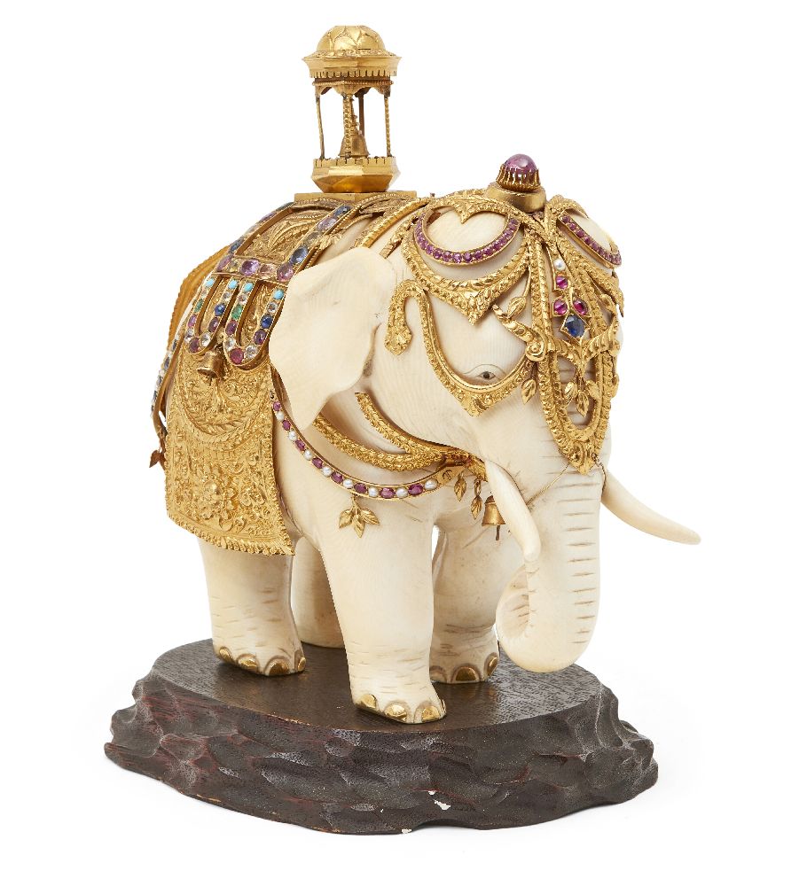 A gem-set, gilt-silver mounted ivory elephant, Ceylon (Sri Lanka), circa 1910, on an oval wood base, - Image 2 of 2