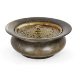 A bronze basin for ablutions, Mughal India, 17th century, of waisted form with wide rim, the