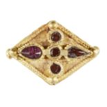 AMENDENT: Please note the measurements are 2.4cm wide and 1.4cm high. A garnet set gold element,