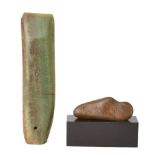 An inscribed archaistic jade axe head and a inscribed stone scholar's rock on a black plinth, China,