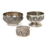 Two silver footed bowls, India, 19th century, and a lidded casket, the first repousse decorated with