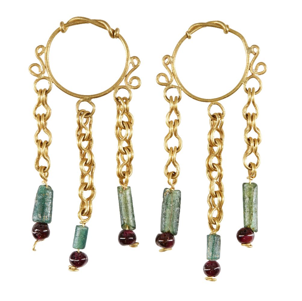 A pair of gold earrings in the Roman style, the hoop with twisted wire detail, each with three