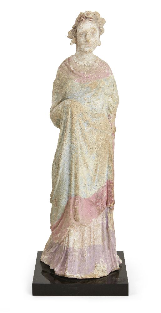 A Canosan terracotta female figure, circa 3rd century BC, with traces of blue, pink and purple